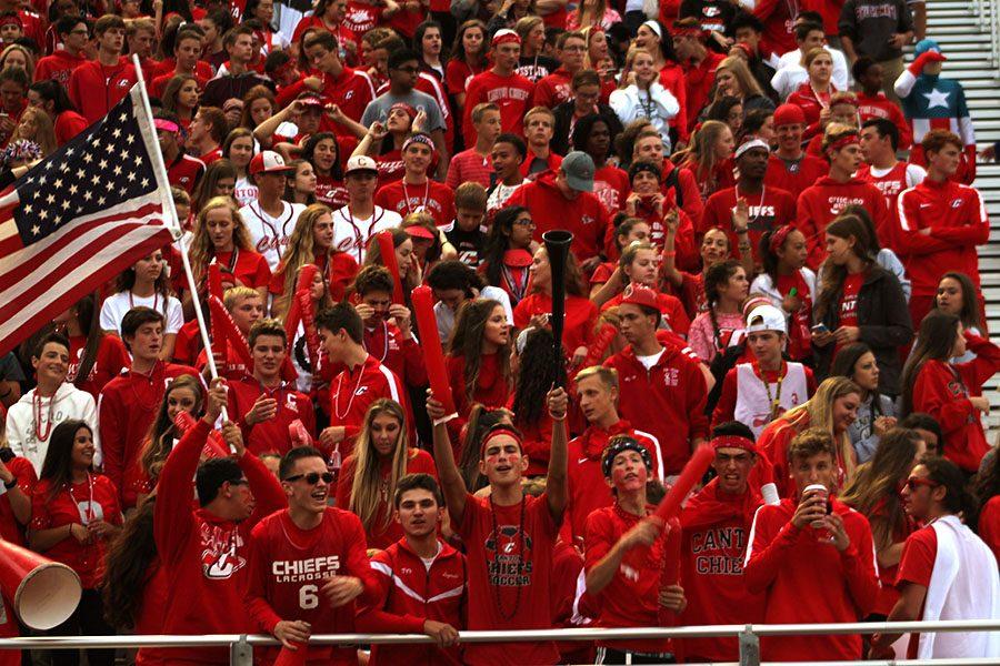 The Canton Student Section show off their school spirit by wearing red as their football team plays against rival school, Plymouth.