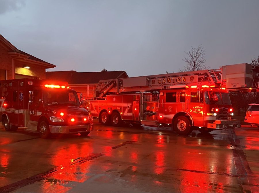     Canton fire truck and ambulance sit outside of the Canton station during rainy conditions. April 24, 2022.