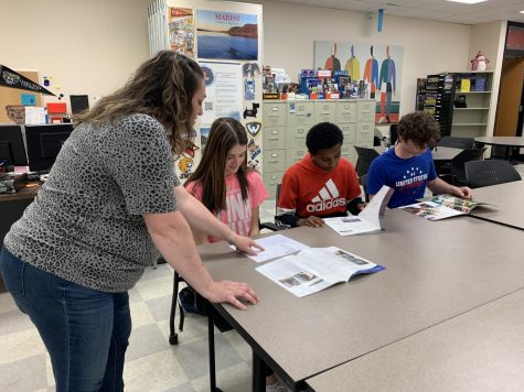 Career Center Coordinator Margaret Styes assists students Hailey Ricardi, Baakal Berhan and Kai Henkel with their Armed Services Vocational Aptitude Battery (ASVAB) tests at P-CEP’s career center. May 12, 2022.