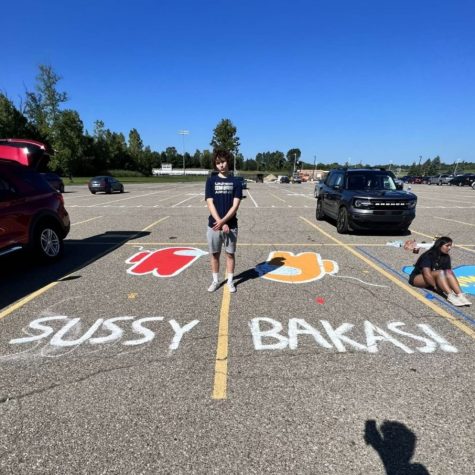 Tommy Wegner, Salem senior, paints two Plymouth High School parking lots based on internet memes stemming from the 2018 video game “Among Us.” August 31, 2022. 
