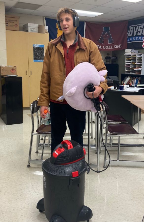 Evan Holmberg, Plymouth senior, takes his materials to school in a Squishmallow. October 13, 2022.