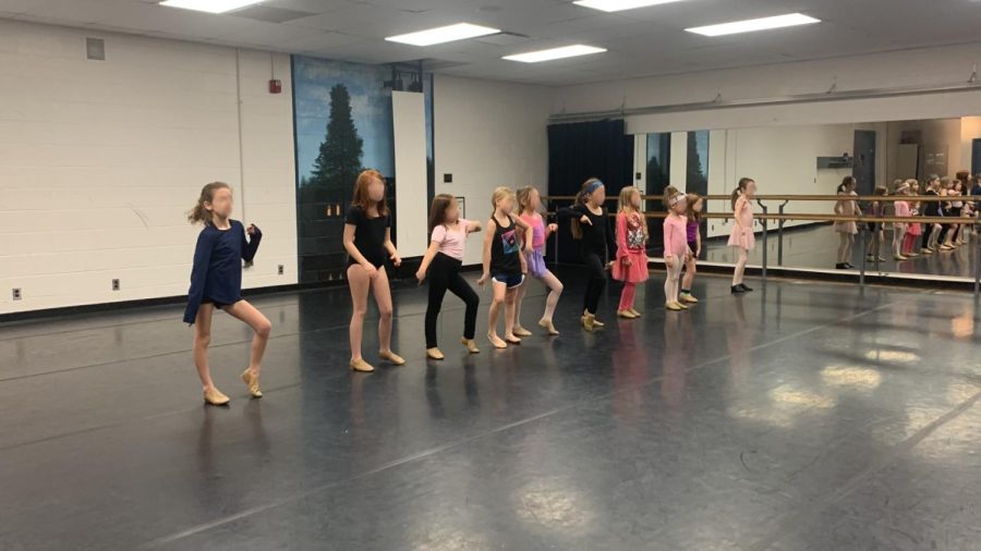 Julia Rodriguezs jazz class strikes a move at the beginning of their dance routine in Canton, Michigan. December 2022.