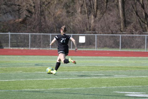 Ashleigh Vernier, Plymouth junior, dribbles down the pitch during her game at Plymouth High School. April 13, 2022.