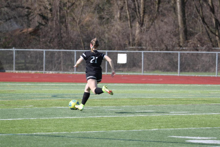 Ashleigh+Vernier%2C+Plymouth+junior%2C+dribbles+down+the+pitch+during+her+game+at+Plymouth+High+School.+April+13%2C+2022.