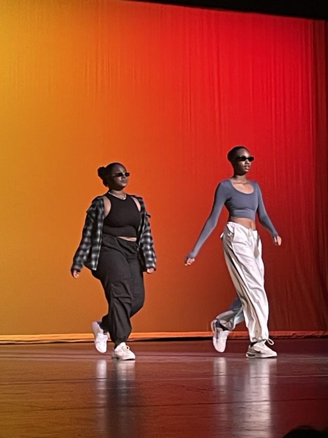 Kayla Kelly and Tamaiya Brown, Plymouth junior, walk the runway dressed in early 2000s fashion. February 15, 2023.