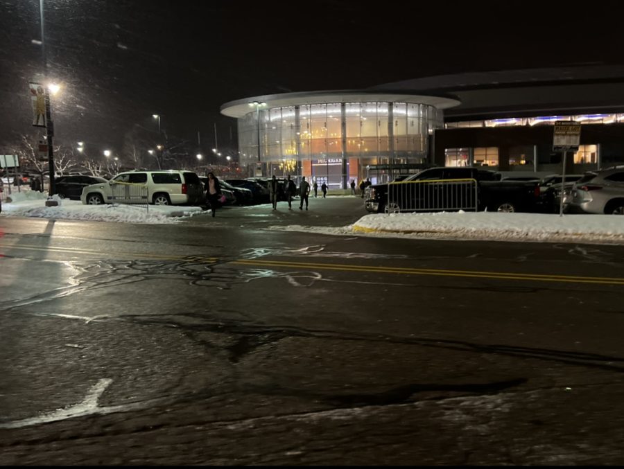 An exterior view of Crisler Center, Michigan’s home arena, shows fans leaving the building as the game comes to a close. January 26, 2023.