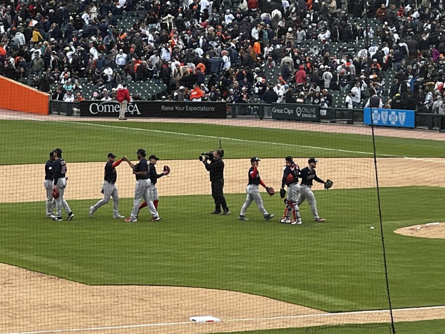 The Boston Red Sox defense high five each other after recording the final out of the game to add another win to their 2023 record. April 6, 2023.