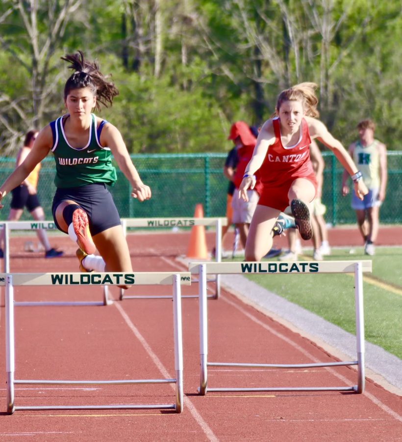 Rinaldi+leaps+over+a+hurdle+during+her+race+at+the+KLAA+Championsip+meet+at+Novi+High+School+on+May+13%2C+2022.+