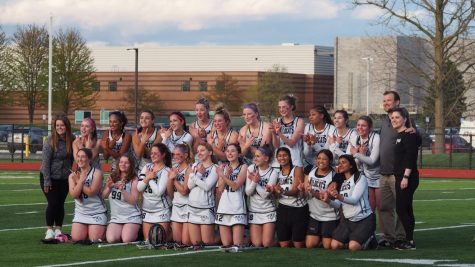 The Plymouth Girls Varsity Lacrosse team poses and forms a “W” with their hands after defeating Salem. May 4, 2023.