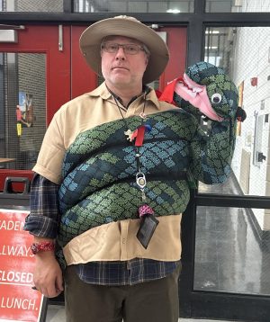 David Reed-Nordwall, Canton High School principal, embraces the cobra spirit decision with his costume. November 27, 2023. 