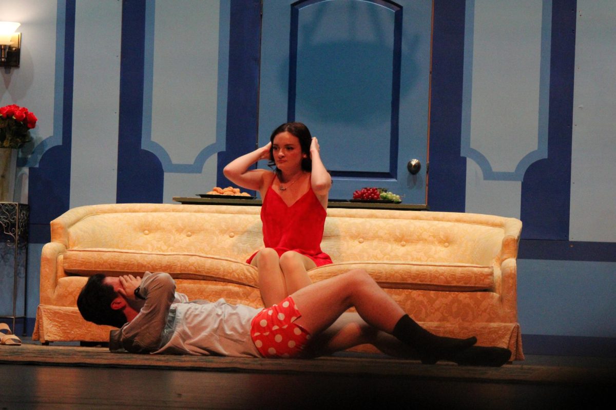 Carlo Nucci (Maxwell Steward) and Mimi Merelli (Adalyn Cowan) have their cover blown after having the blanket taken off the couch in the Park Players production of A Comedy of Tenors. Nov. 2023.