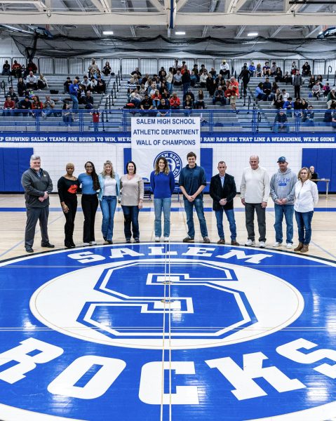 2024 inductees of the Salem Wall of Champions come togeter during halftime of the Salem v.s. Canton Boys Varsity Basketball game. Feb. 9, 2024.