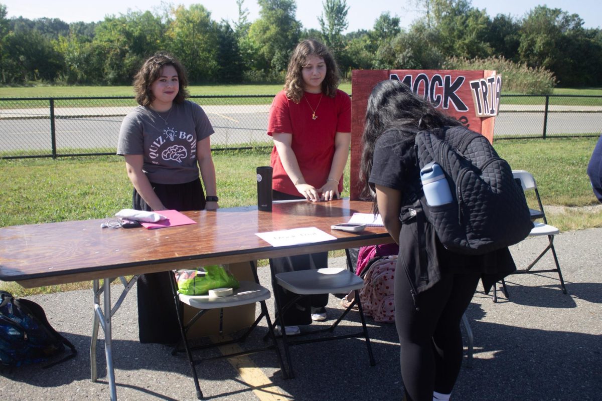 Salem senior Ava Boccarossa (left) and Canton sophomore Hayat Hawari (right) invite a new student to sign up for Mock Trial Club. Mock Trial meets on Mondays from 2:30 - 3:30 p.m. at CHS  242. Sept. 17, 2024.