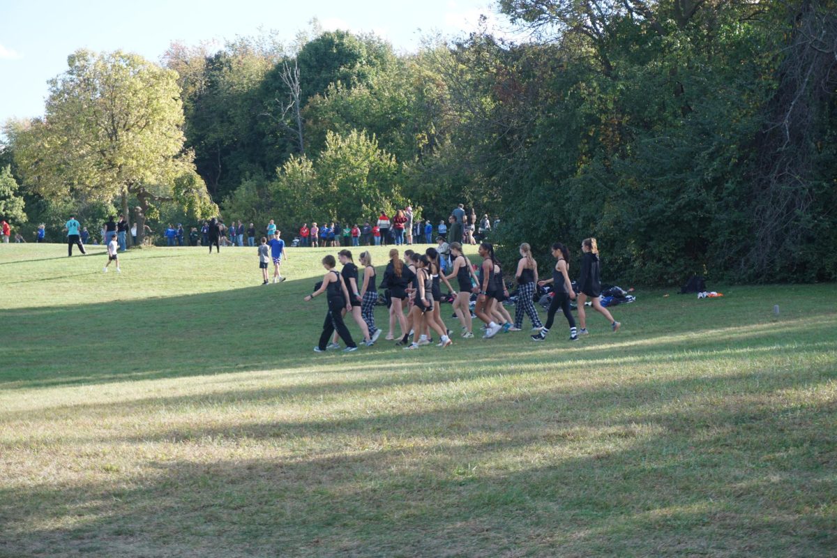 Plymouth Girls Cross-Country team warms-up together before final meet of the season. Oct. 8, 2024.