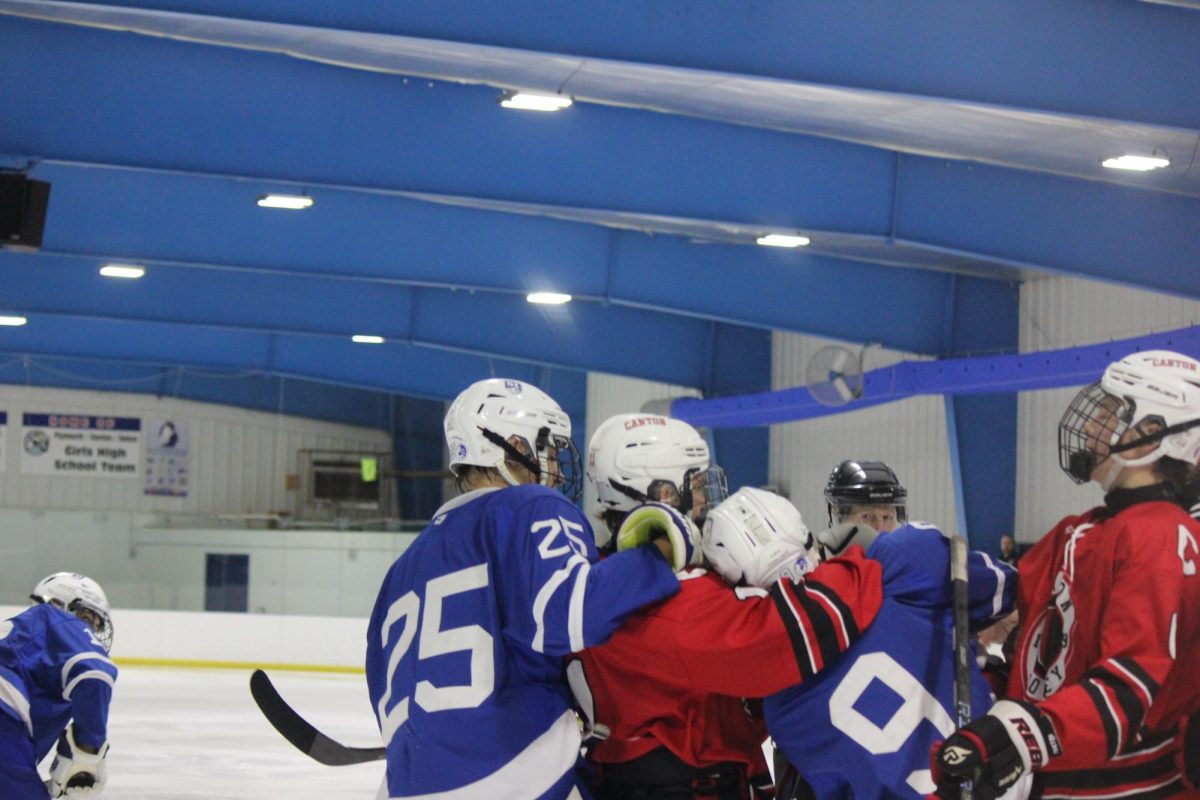 A fight breaks out after Salem player Karsen Patel gets shoved into the Canton net. Dec. 8, 2024