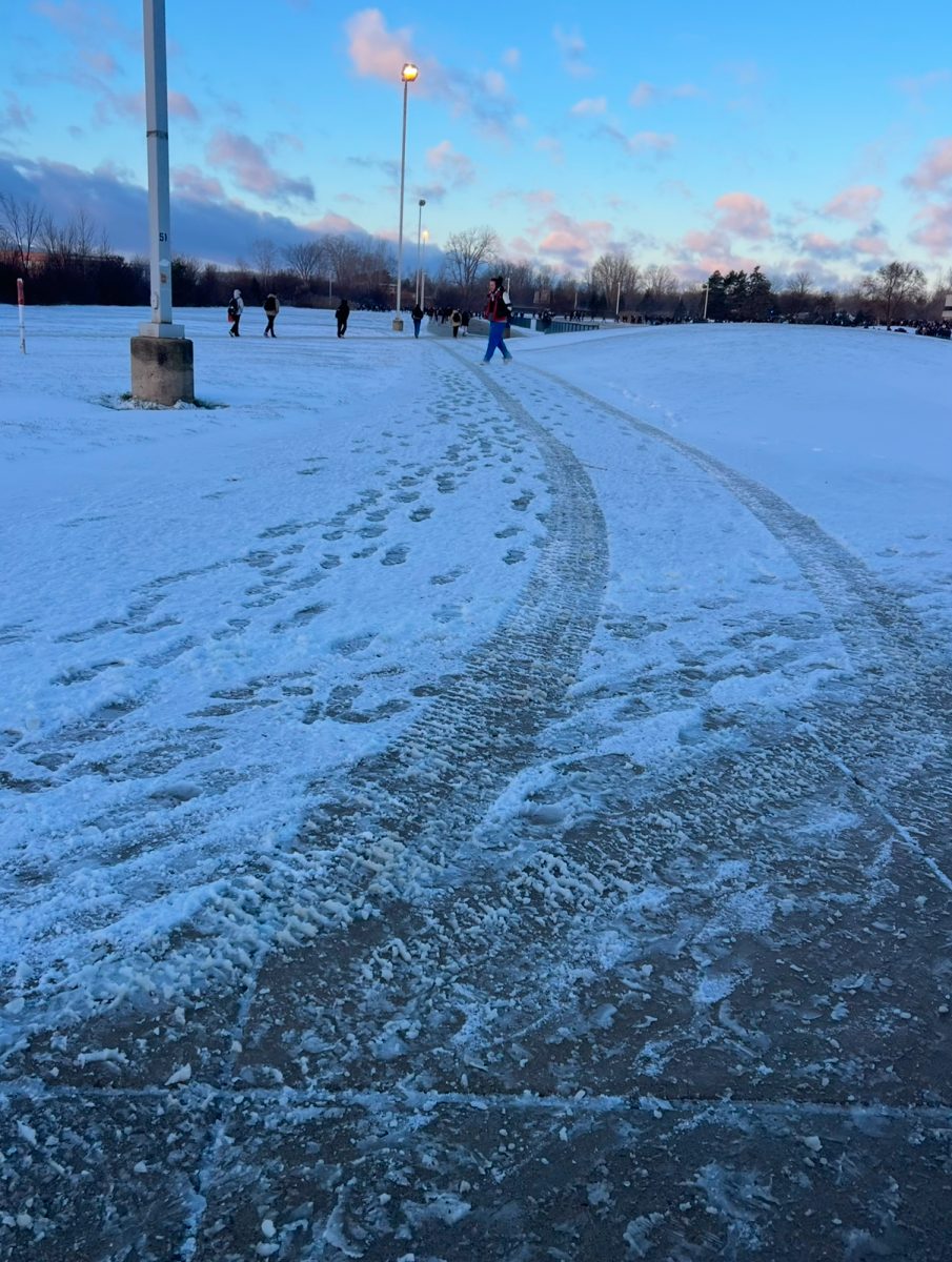 The slick paths at P-CEP between Cantons’ Phase three and the bus loop at Salem High School after a couple inches of snowfall. Dec. 12 2024.