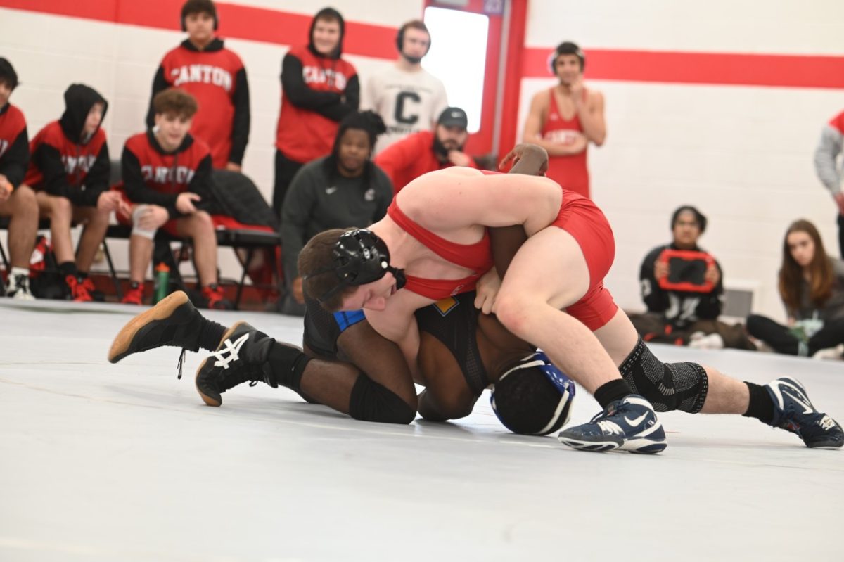 Canton Junior Ethan Curry works to pin his opponent at a dual wrestling tournament against Redford Union. January 4, 2025.