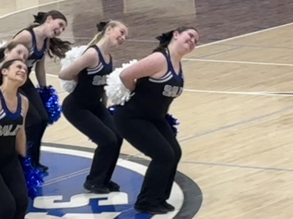 Junior Eloise Morante fronts the Salem Pom team on the gym floor during the Salem Varsity Girls Basketball game against Howell. February 4, 2025.