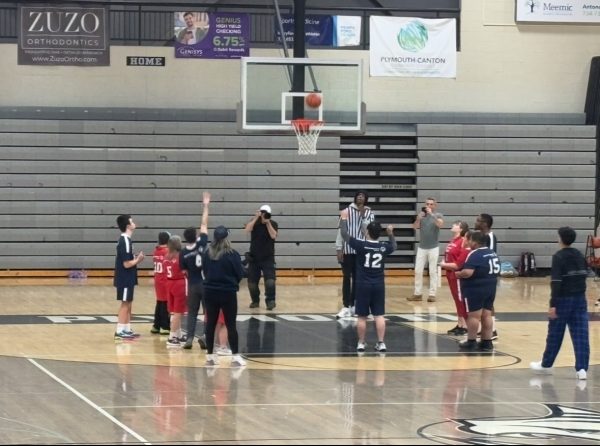 Albert Zhou converts a free throw for the Star Bursts at the Area 23 Special Olympics Basketball Tourney at Plymouth High School. January 13, 2024. 