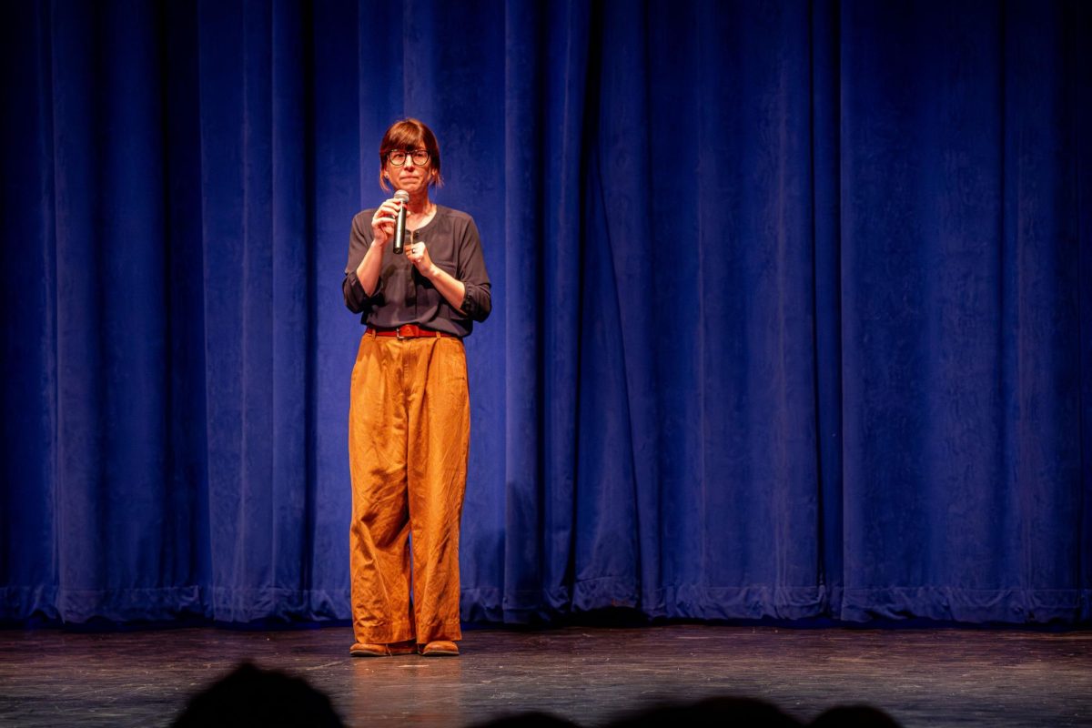 Plymouth Assistant Principal Amy Willacker-Brown speaks to P-CCS eighth graders from Discovery Middle School and East Middle School, encouraging them to start thinking about getting involved in visual and performing arts courses at the Collage Concert held in the Gloria Logan Auditorium at Salem High School, Feb. 5, 2025.