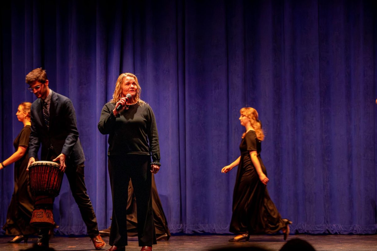 Jennifer Neumann, P-CEP choir director, speaks about the P-CEP choirs and introduces the P-CEP Festival Singers at the Collage Concert held in the Gloria Logan Auditorium at Salem High School, Feb. 5, 2025.