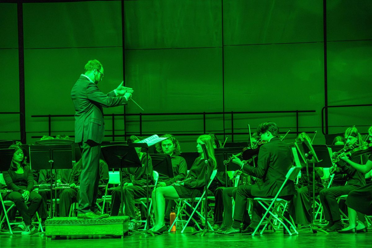 Michael Edwards, Canton music teacher, conducts the P-CEP Symphony Strings/Electric Orchestra as it plays “Swamp Thang” composed by Richard Meyer at the Collage Concert held at the Gloria Logan Auditorium at Salem High School, Feb. 5, 2025.