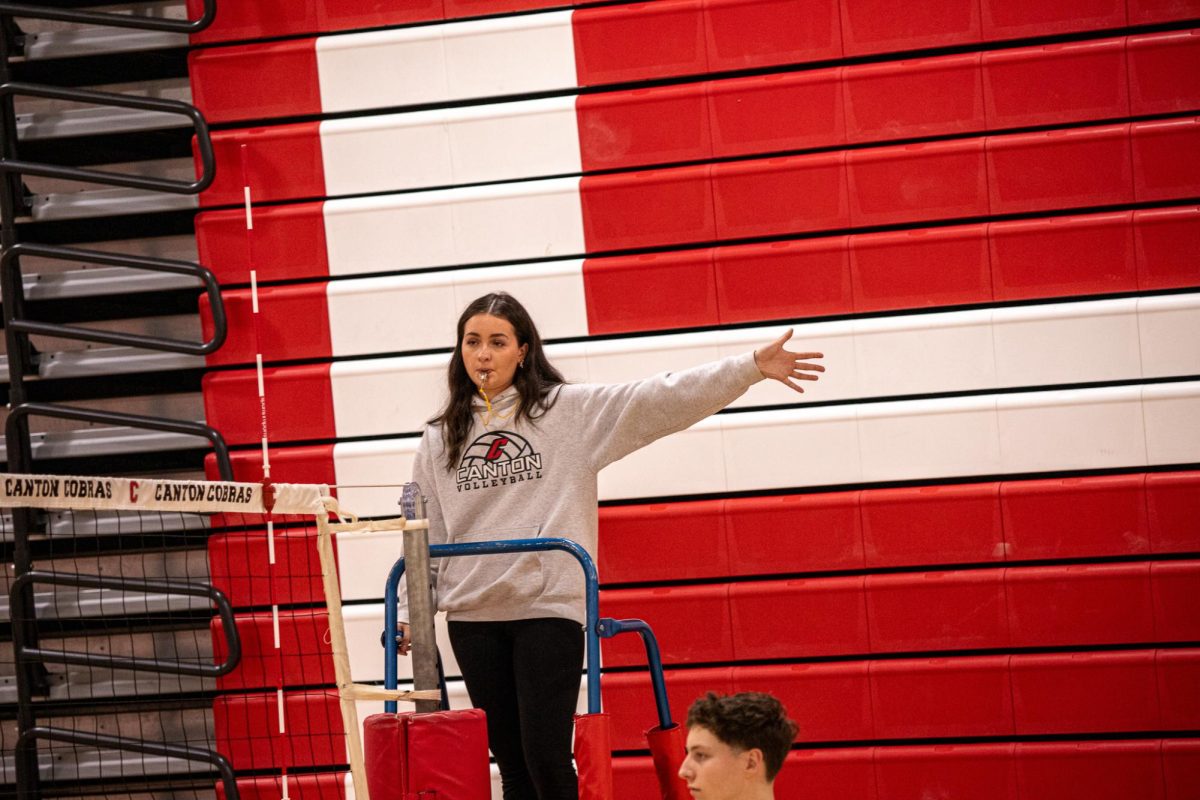 Canton senior Megan Marschak indicates the team on her left earned a point, March 7,2025.