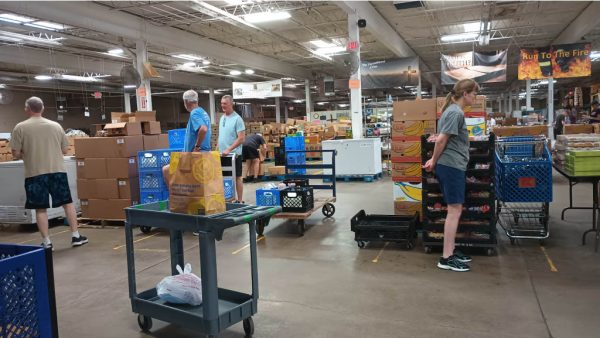 Volunteers help prepare and package food for people in need, May 15, 2025.