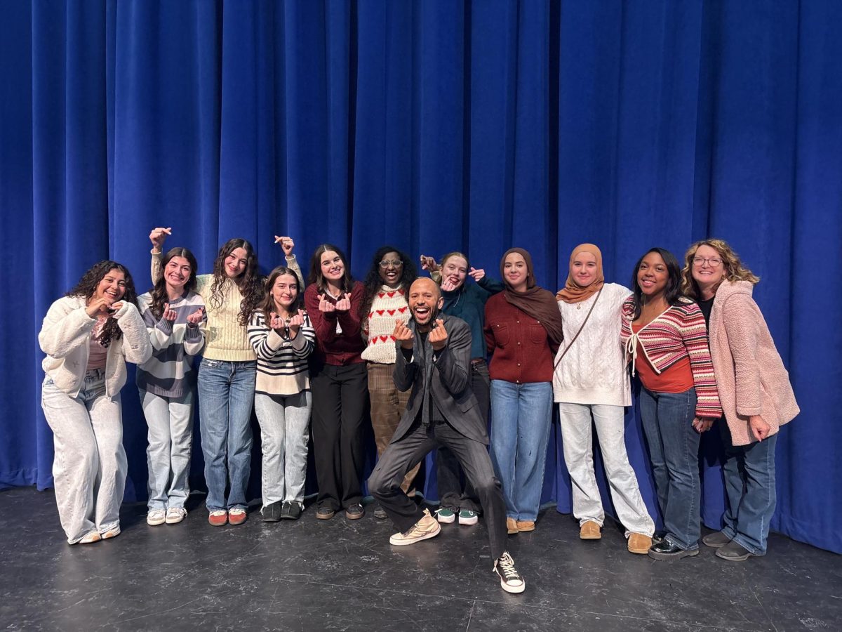 Members of Student Youth Dialogues get together with guest speaker Emund Jones after the show. December 12, 2025.