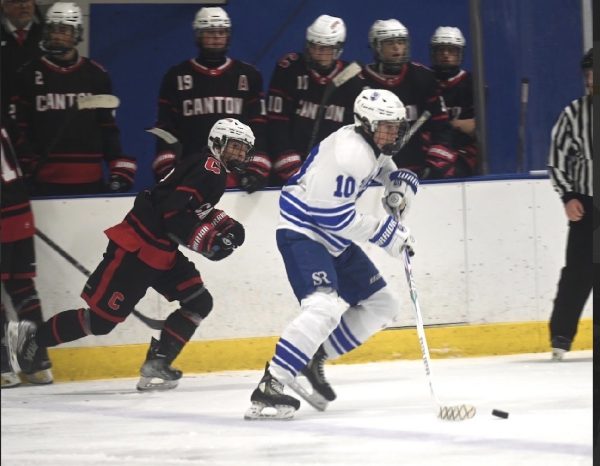 Salem senior Jack Baffy moves the puck along the ice during a game against Canton. Nov. 15, 2025.