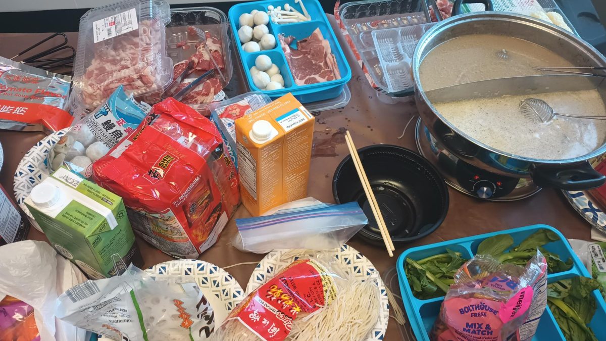 The hot pot meal begins with a table full of ingredients in Li Zhang’s Canton classroom. February 4, 2026. 