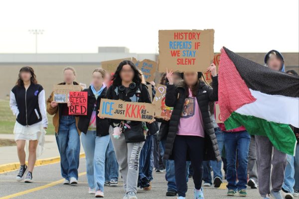 Students lead walkout against ICE, holding signs and a handmade flag of Palestine.  Mar. 25, 2026.