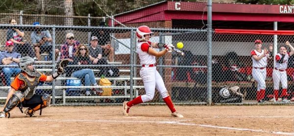Avarielle Spuller connects with the ball during a softball game against Dearborn High School. April 13, 2026