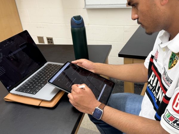 Plymouth senior Amir Baig uses an AI chatbot to assist with taking notes. May 18, 2026.